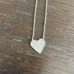 Sterling silver necklace with hammered heart pendant.